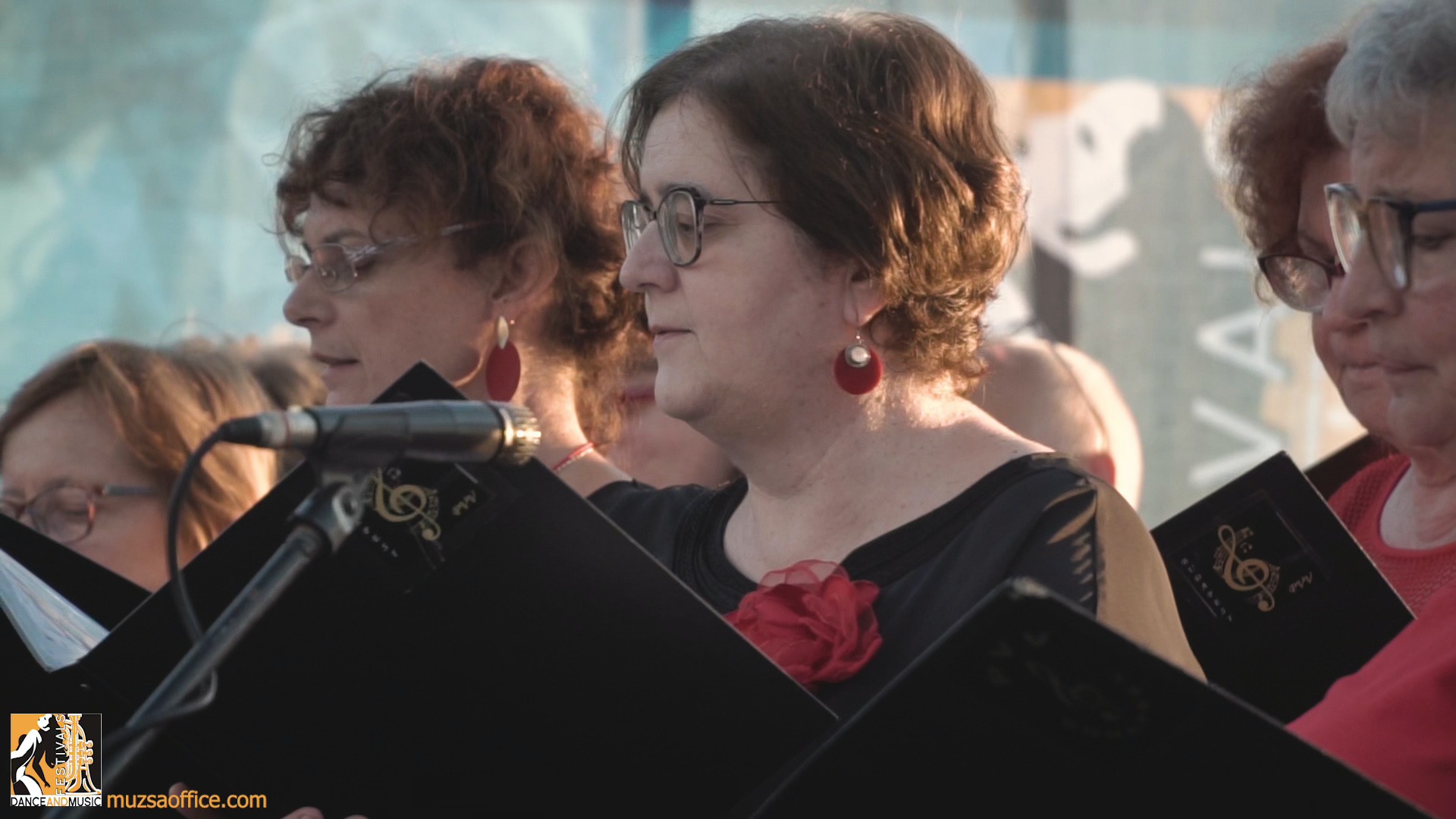 A vibrant folk dance performance by a music band at a European folklore festival, celebrating traditional arts for choirs and majorettes.